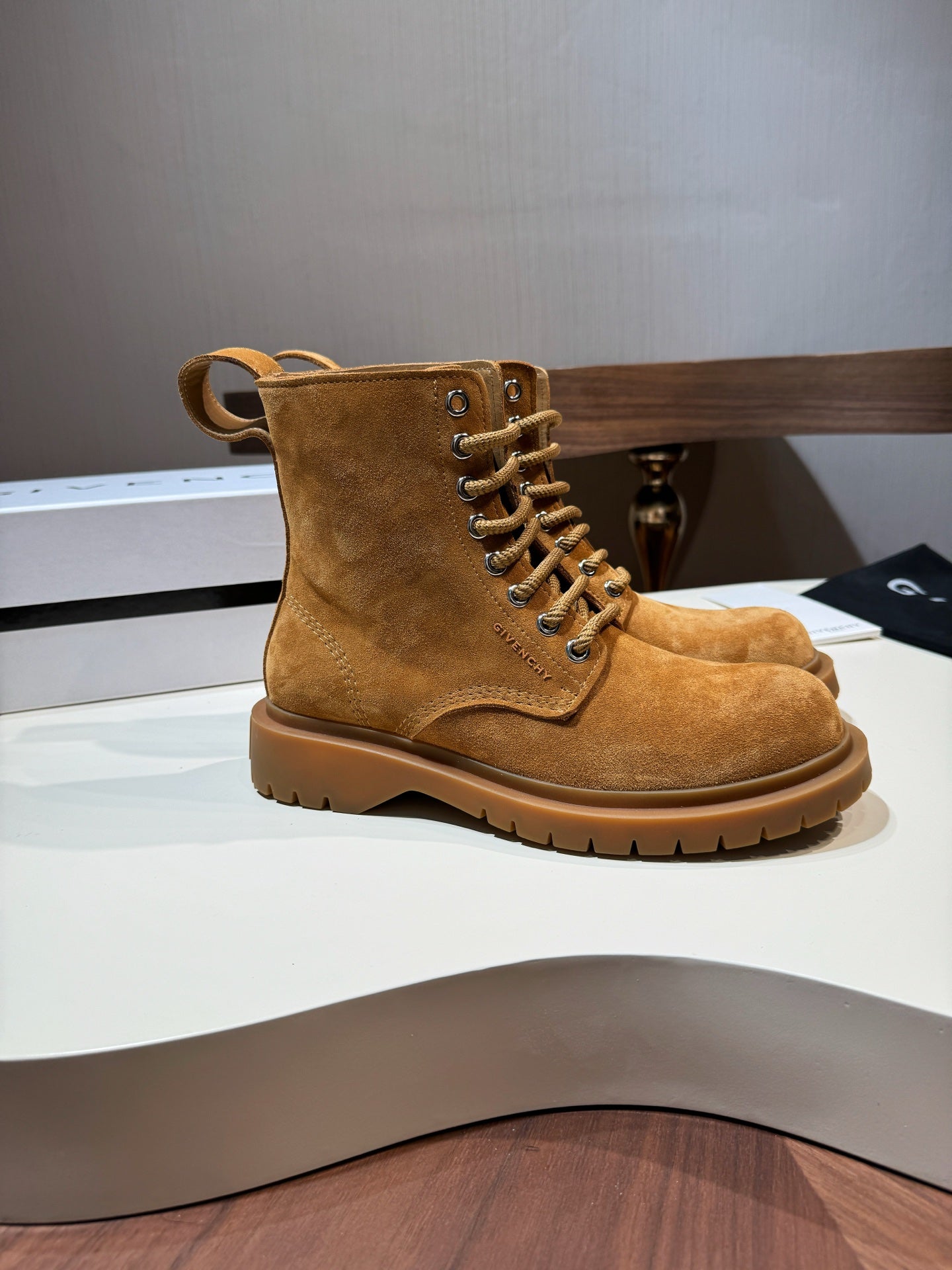 Tan suede lace-up ankle boots with thick lug sole
