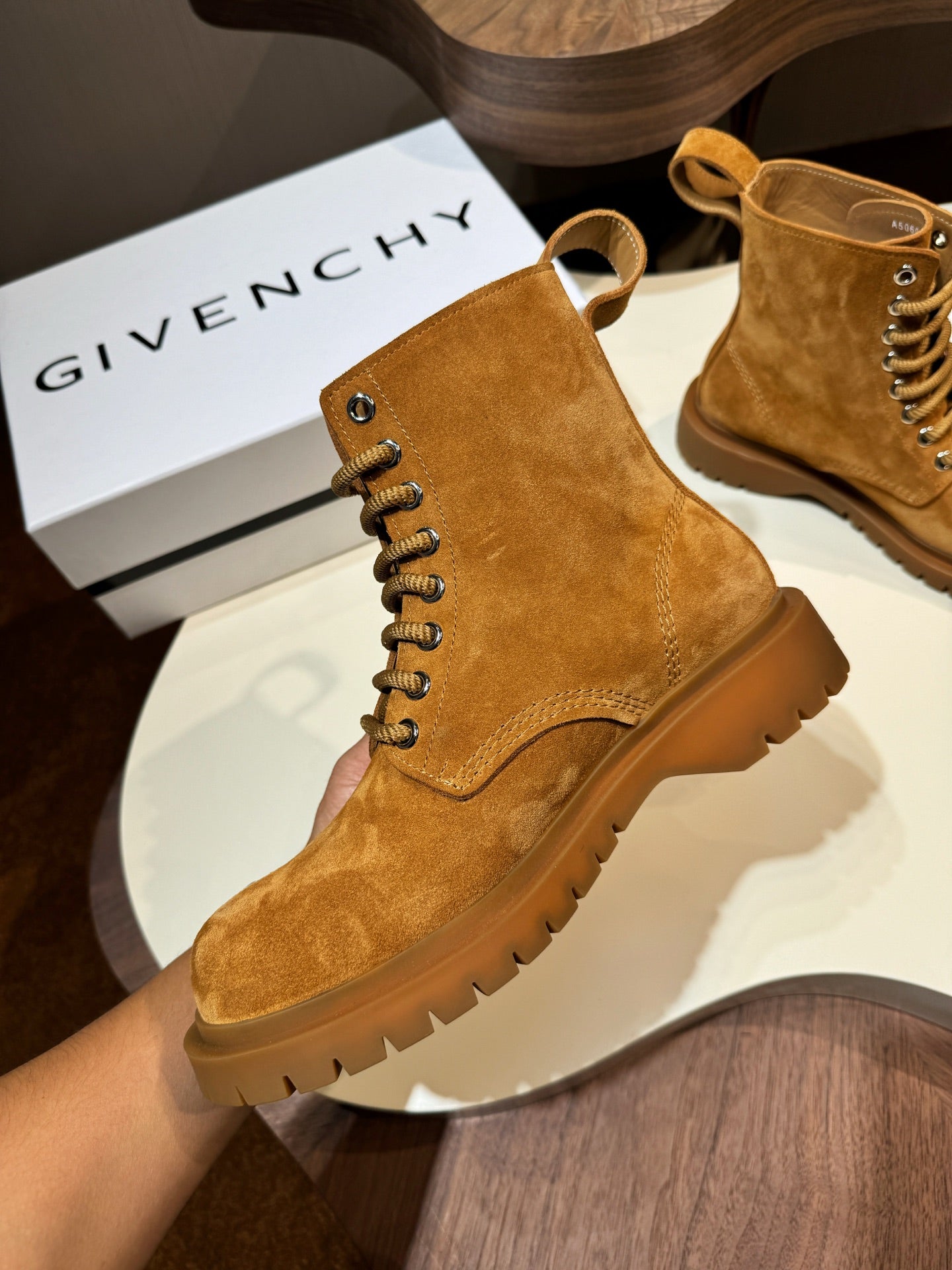 Tan suede lace-up boots with round toe and lug sole