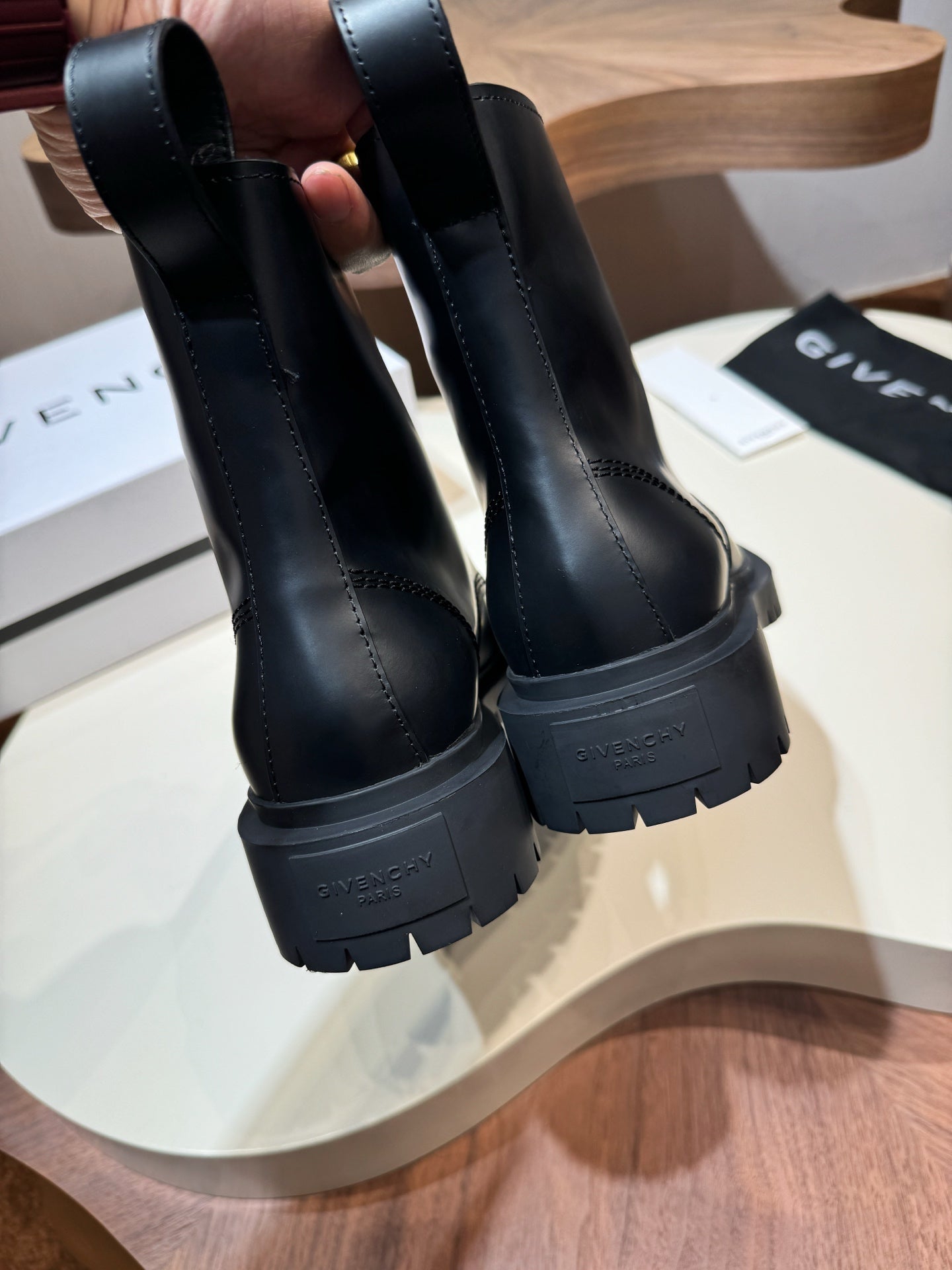 Givenchy black leather boots, back view with logo on heel