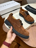 Brown suede lace-up shoe with black chunky sole and round toe