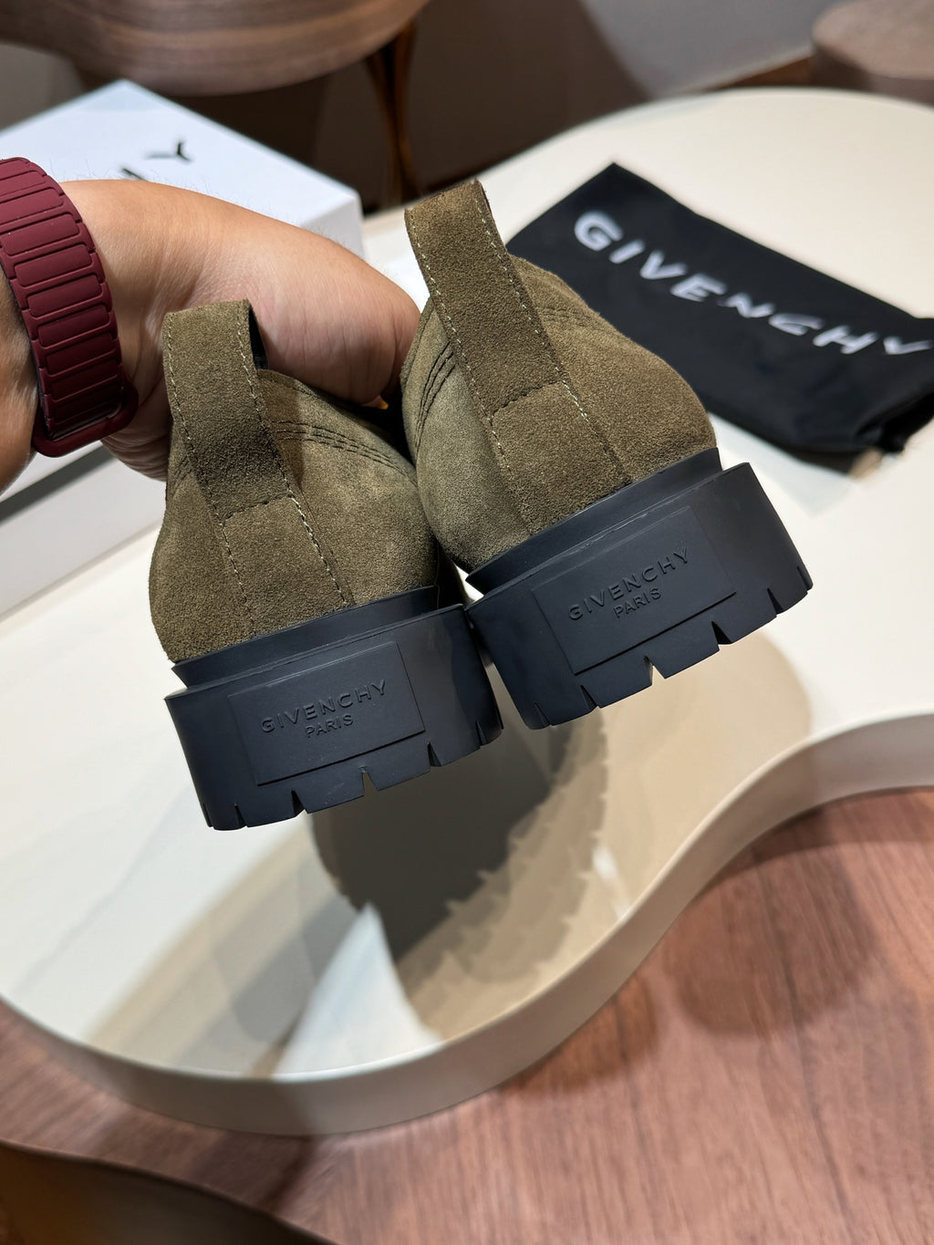 Givenchy olive suede lace-up shoes, rear view with black treaded sole