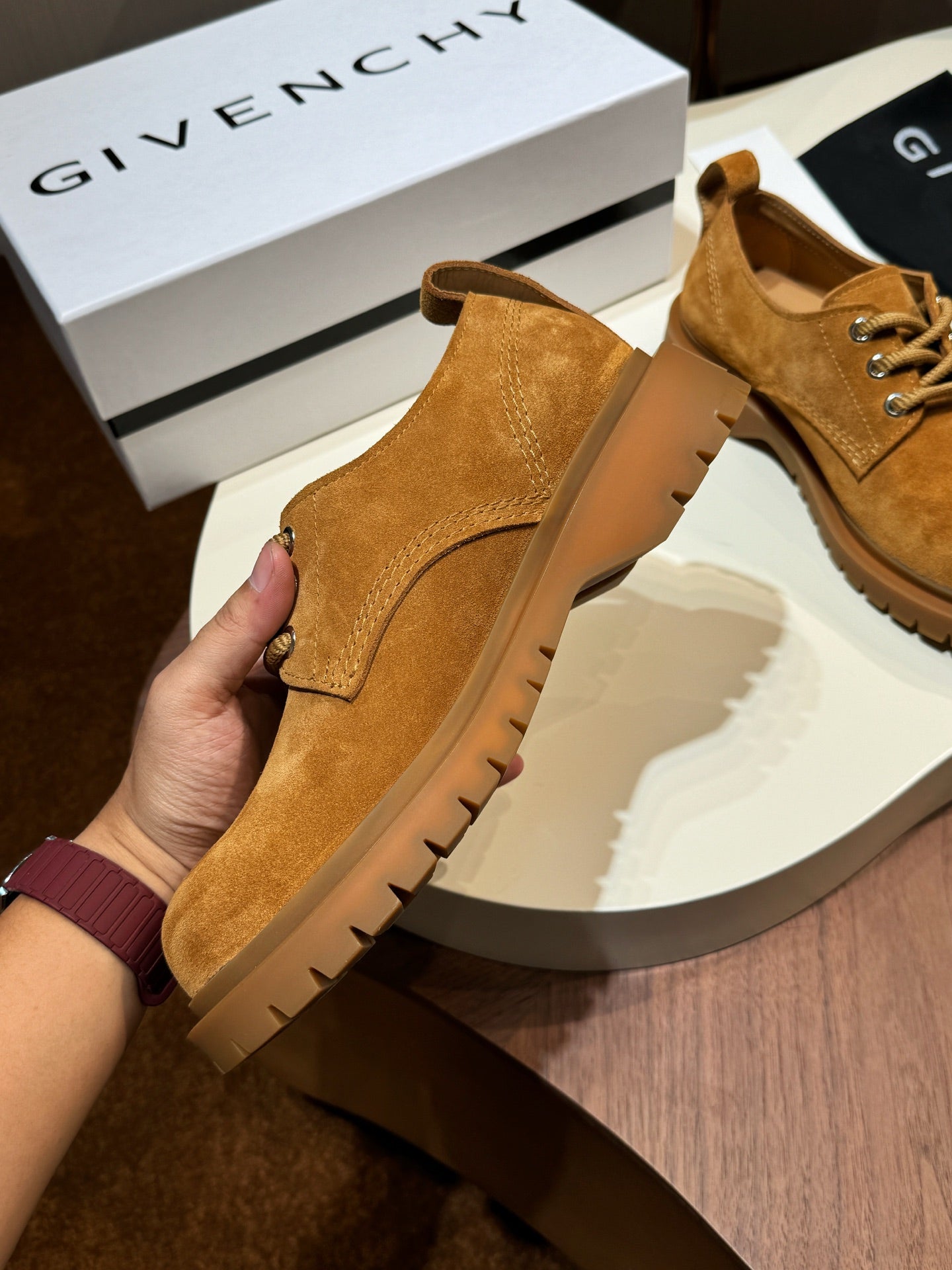 Tan suede lace-up shoes with padded collar and brown lug sole