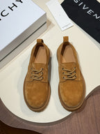 Brown suede lace-up shoes with lace-up vamp and treaded lug sole