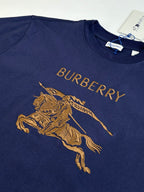 Dark blue short-sleeve T-shirt with large gold horse graphic and Burberry text