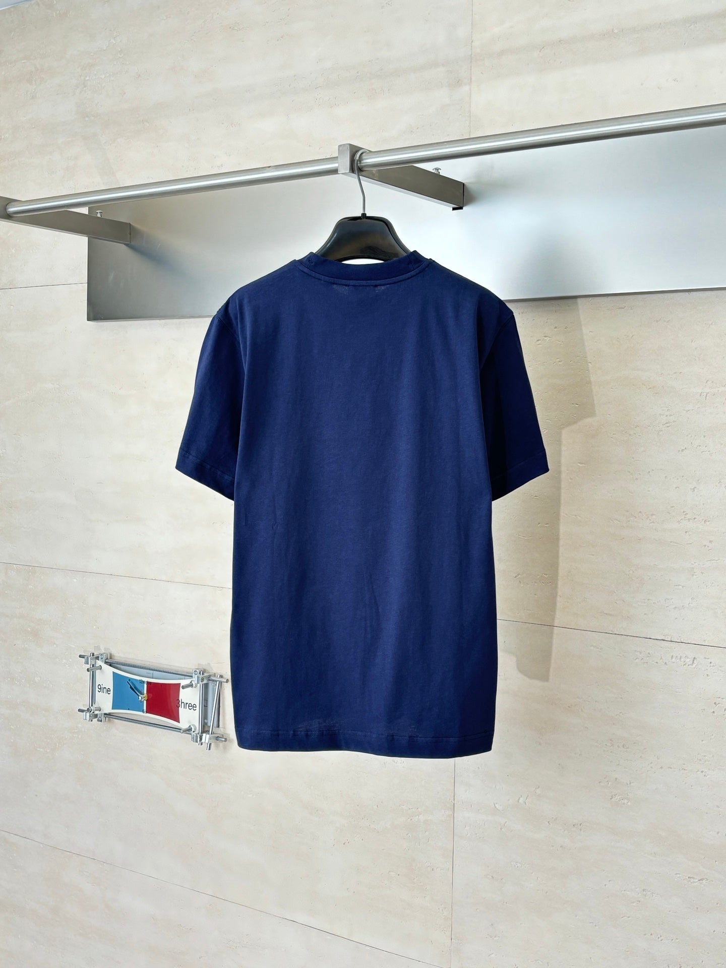 Dark blue short-sleeve T-shirt, back view
