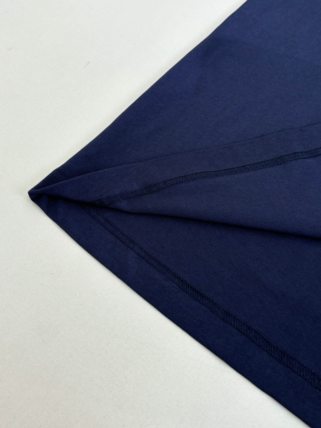 Dark blue T-shirt sleeve hem seam detail