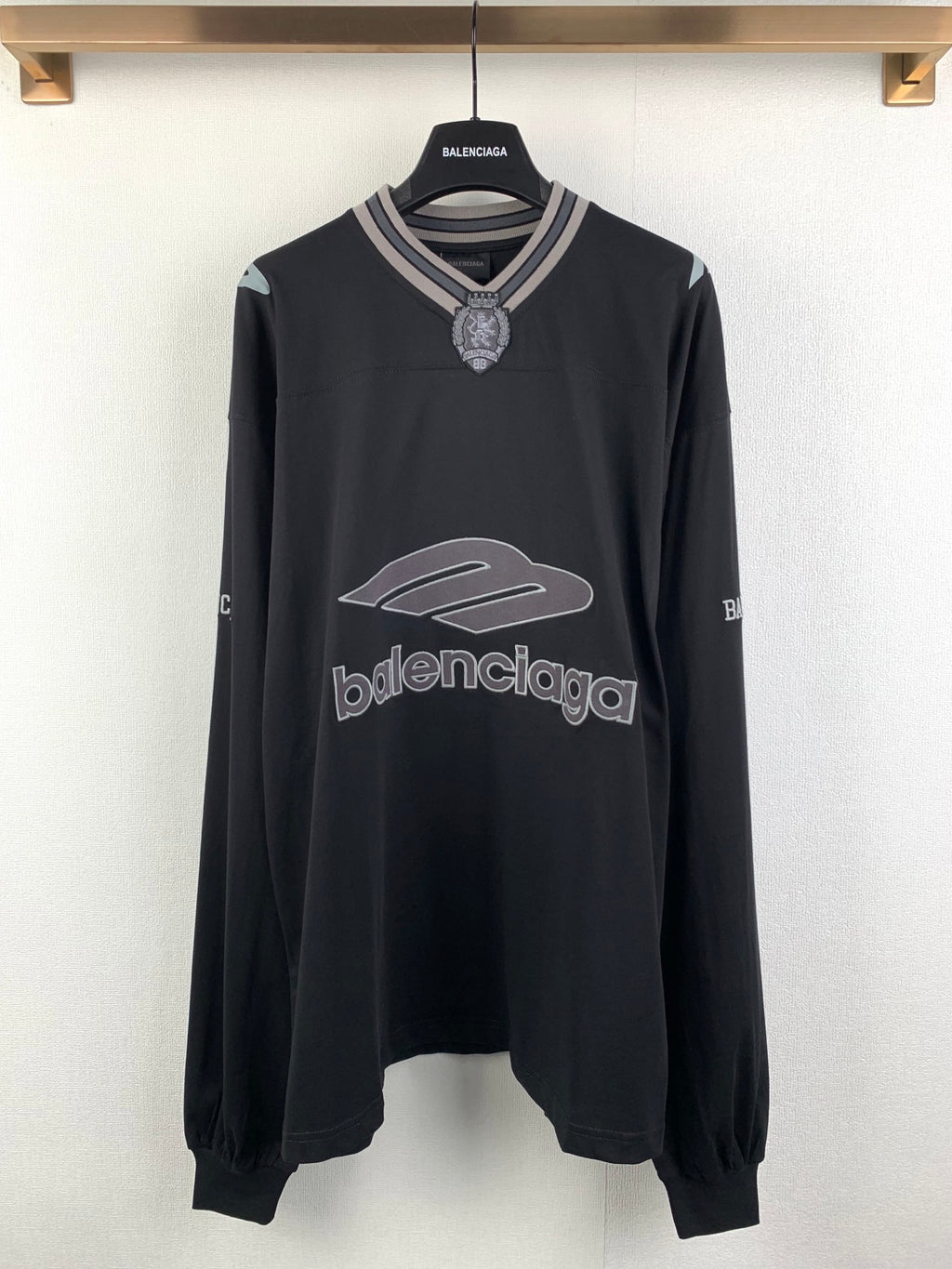 Balenciaga long-sleeve sweatshirt with ribbed V-neck and large logo graphic, dark gray