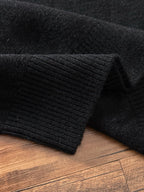 Black ribbed knit sweater cuff and hem detail