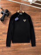 Black crewneck sweater with long sleeves and small triangular Prada Milano logo patch