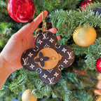 Louis Vuitton monogram flower charm keychain with tan center and gold clasp