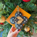 Louis Vuitton monogram flower keychain charm with tan center and gold clasp