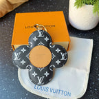 Louis Vuitton monogram flower charm keychain with tan center and gold clasp