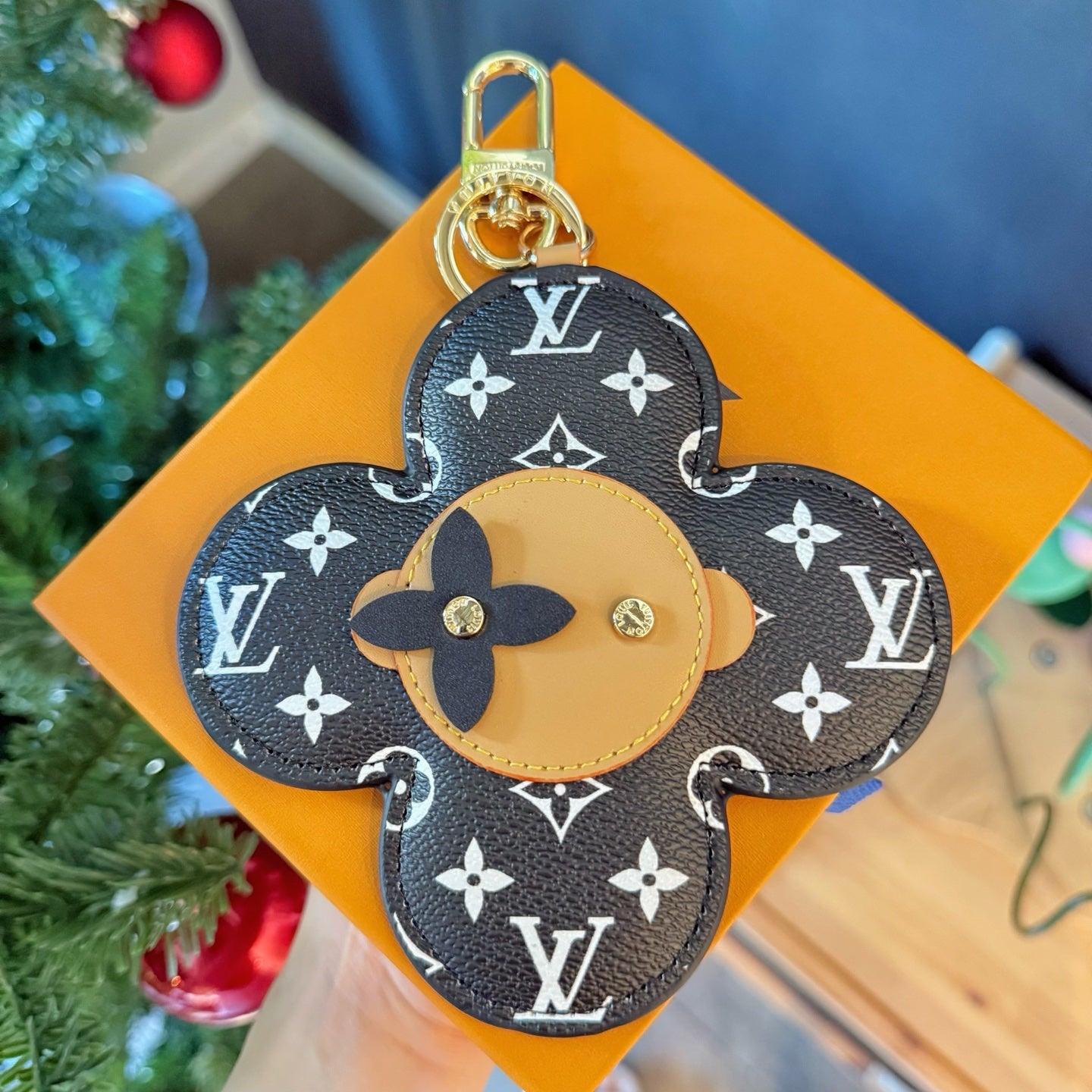 Louis Vuitton monogram flower charm keychain with tan center and gold top ring
