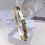 Dior belt in gold leather-look with silver buckle and star charm, shown front side.