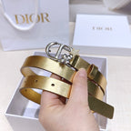 Dior belt in gold leather-look with silver buckle, star charm, and hand-held fit holes.