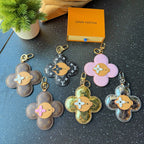 Assorted Louis Vuitton flower keychain charms with monogram patterns and different colors