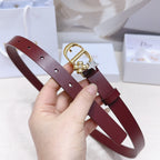 Dior burgundy belt on hand: gold buckle with star, pearl flowers, and cutout holes