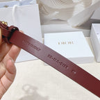 Dior burgundy belt back view with embossed text and leather strap