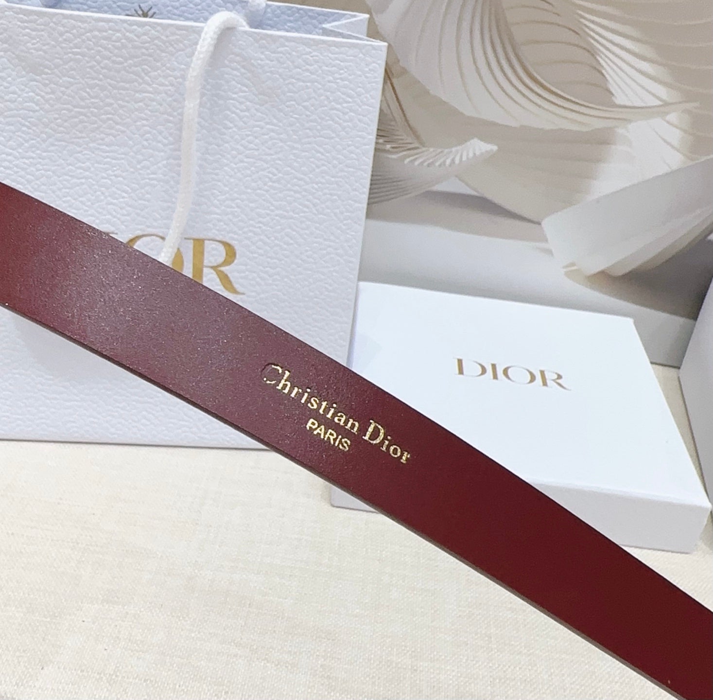Dior burgundy belt back with Christian Dior Paris embossed branding