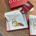 Gucci keychain with gold rings and red leather charm in gift box