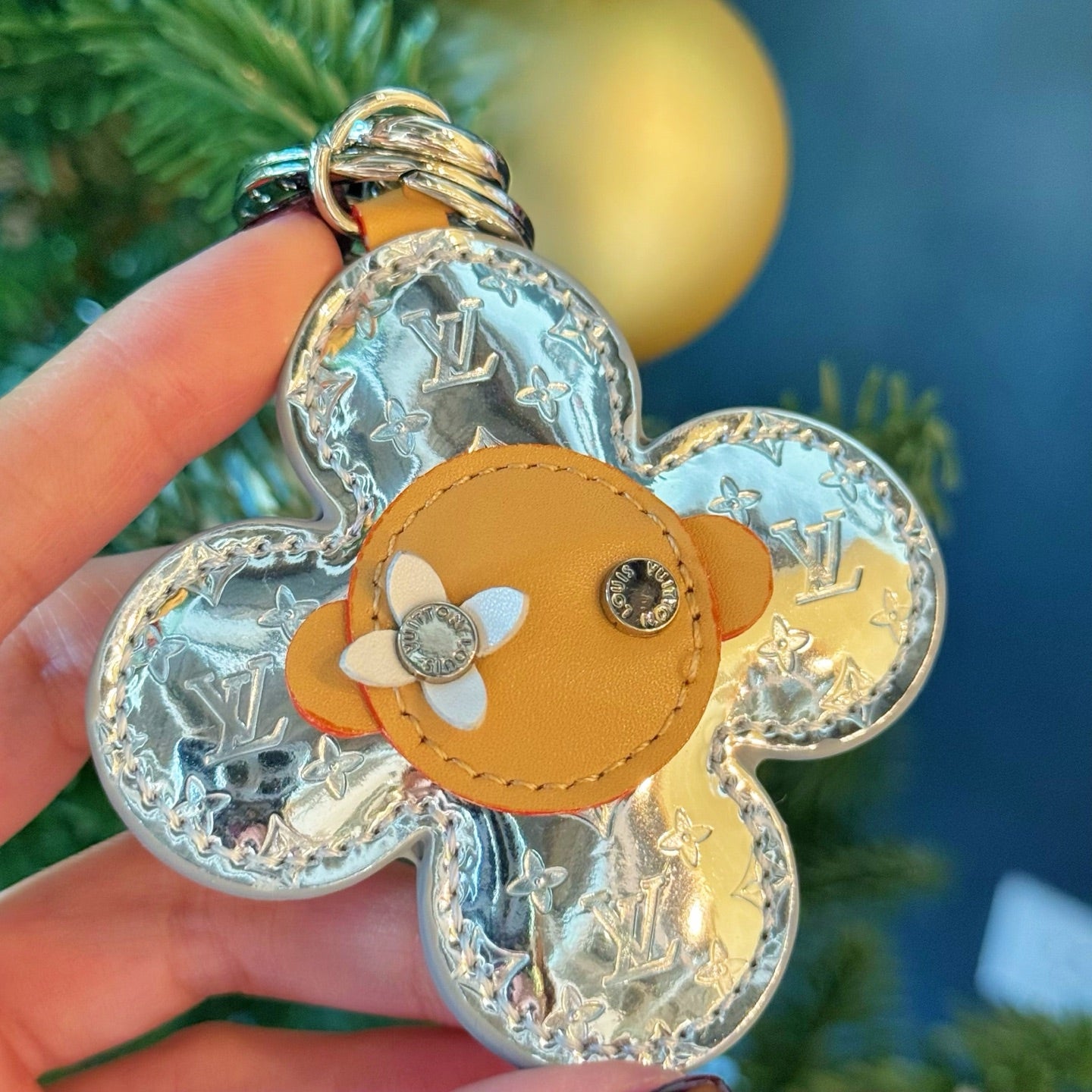 Louis Vuitton monogram flower keychain charm with blue-silver fabric and tan center