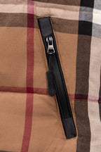 Burberry plaid puffer jacket front zip pocket with black zipper pull
