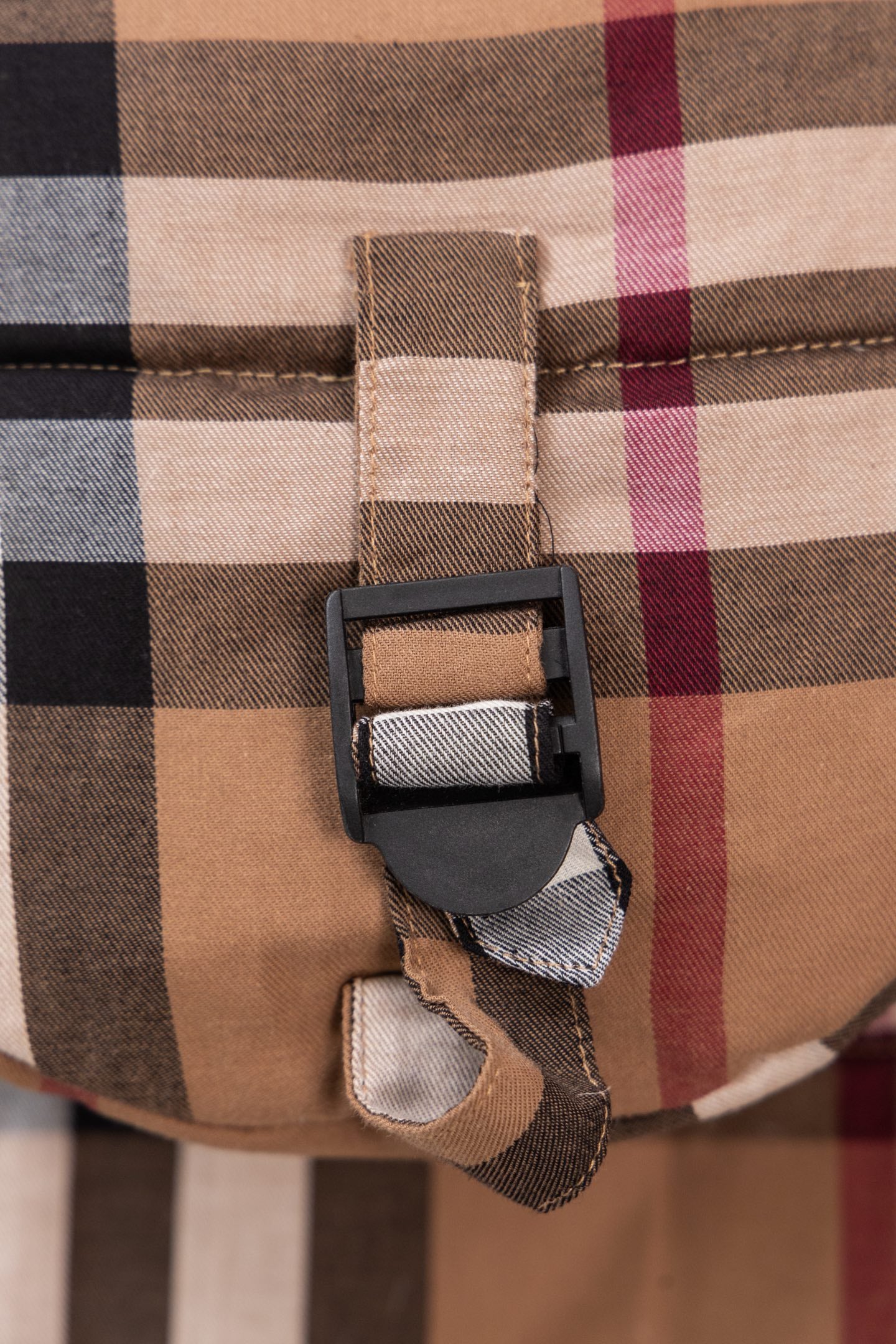 Burberry plaid puffer jacket hood strap buckle with black webbing