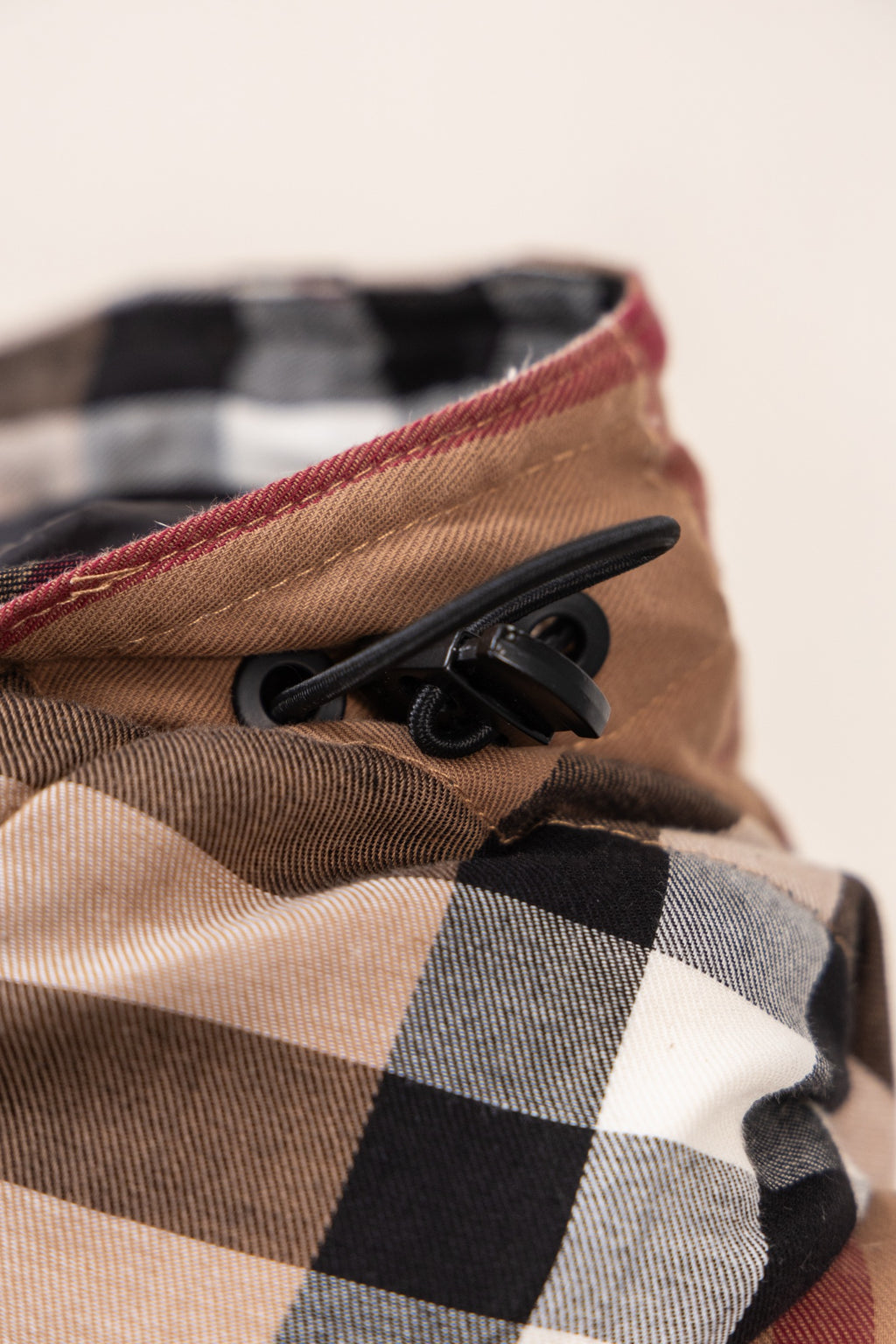 Burberry plaid hood edge with black drawcord and beige lining