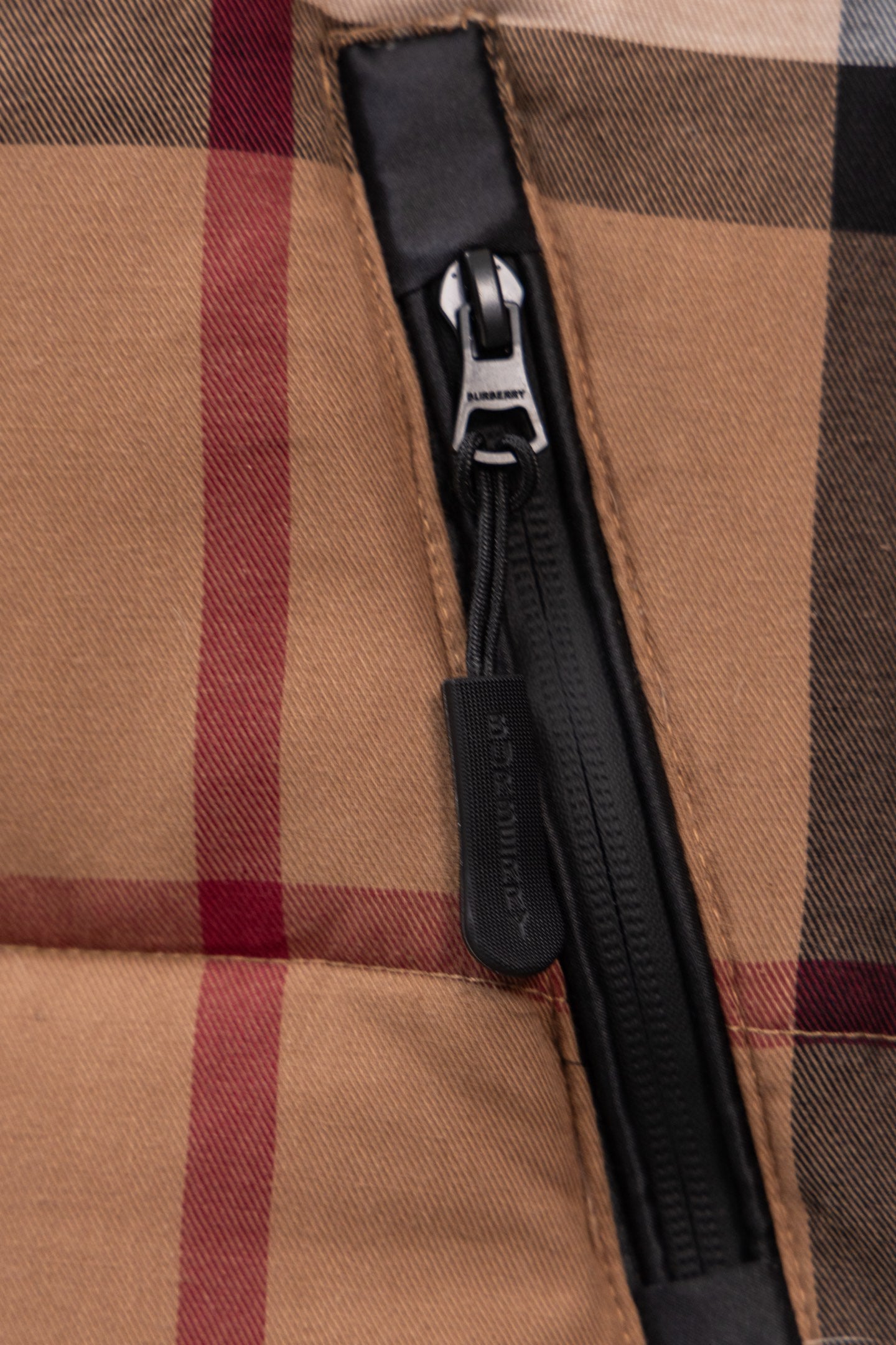 Burberry plaid puffer jacket front zipper and pull tab