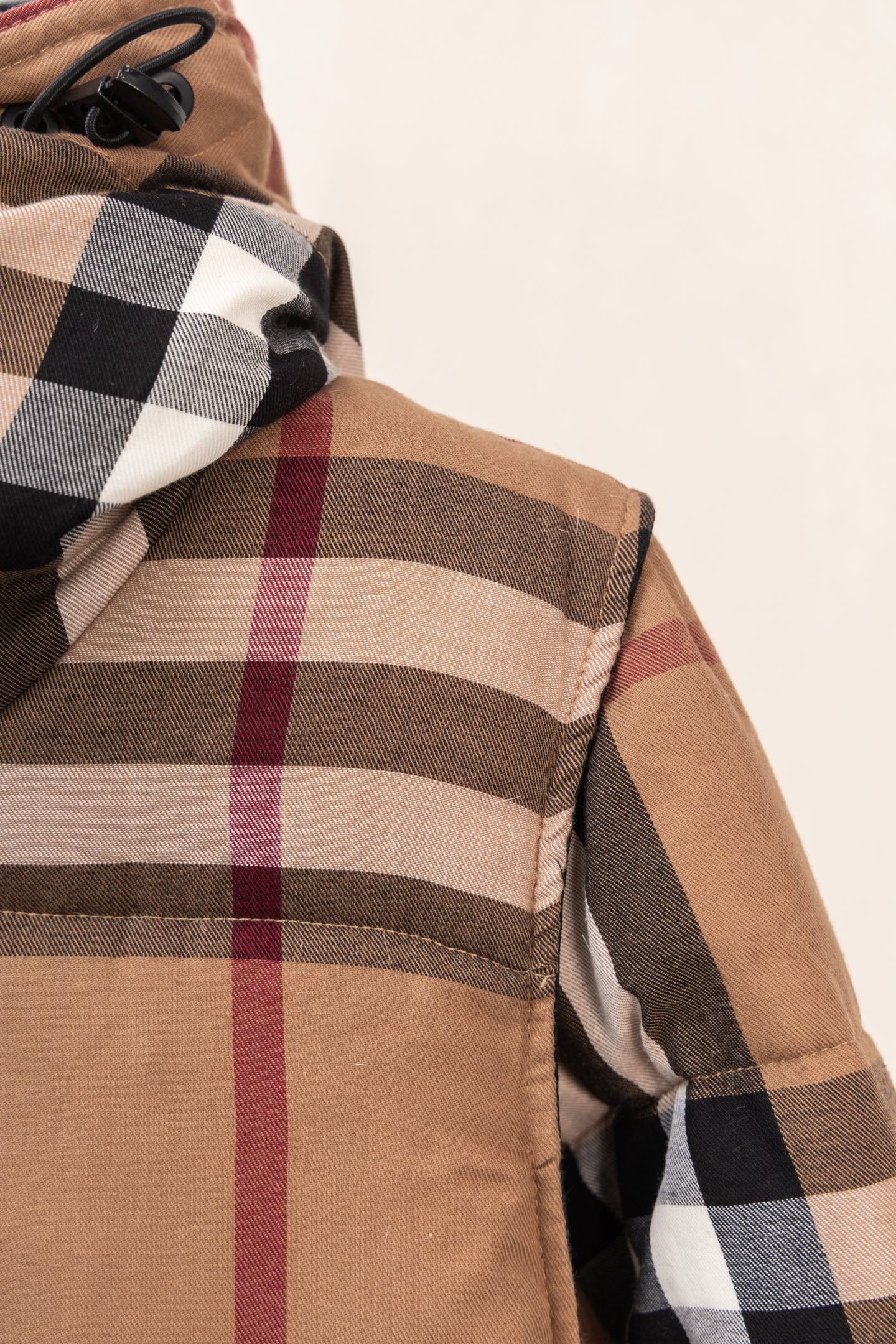 Burberry plaid puffer jacket shoulder with folded hood and button placket