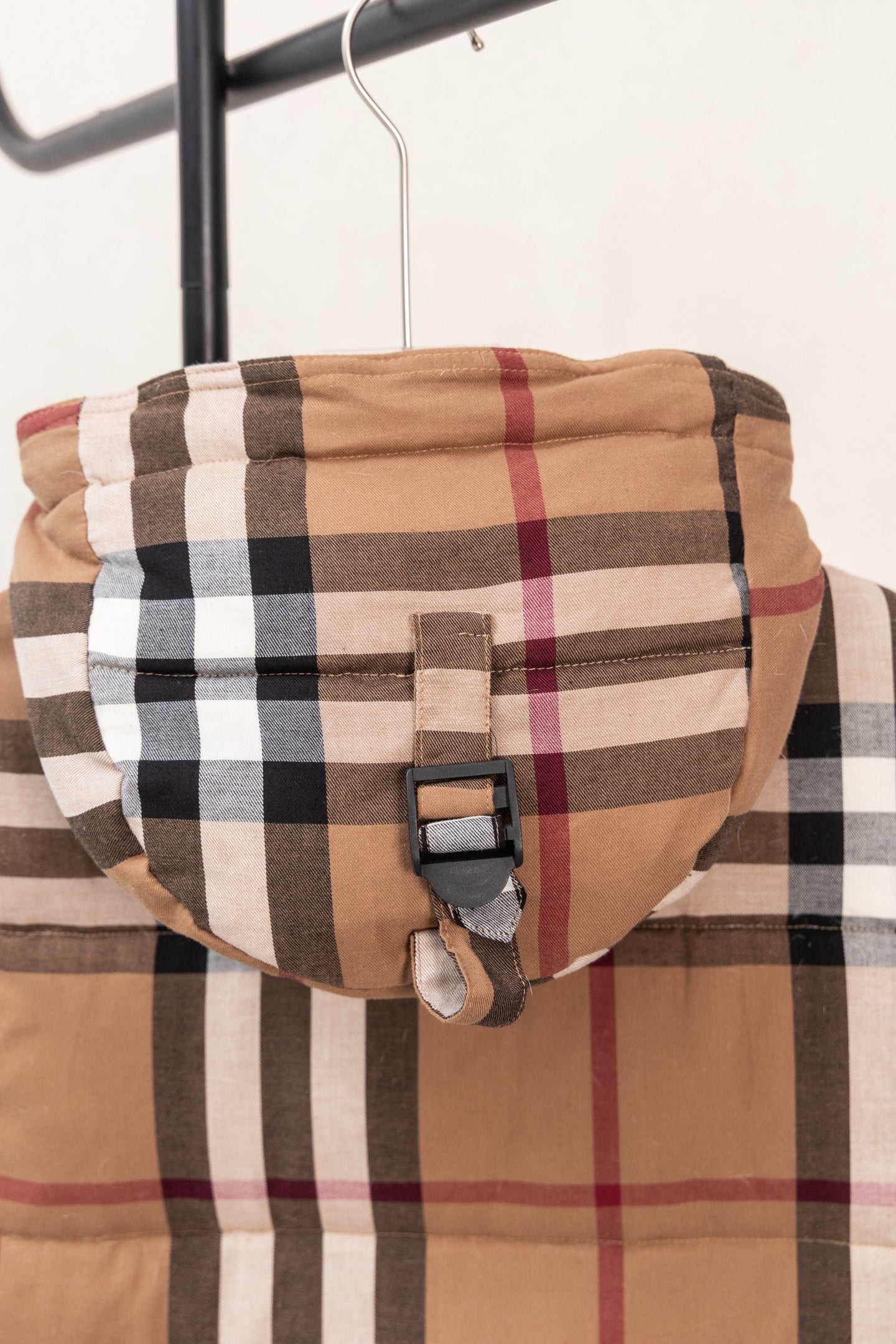 Burberry plaid puffer jacket hood with adjustable strap and buckle
