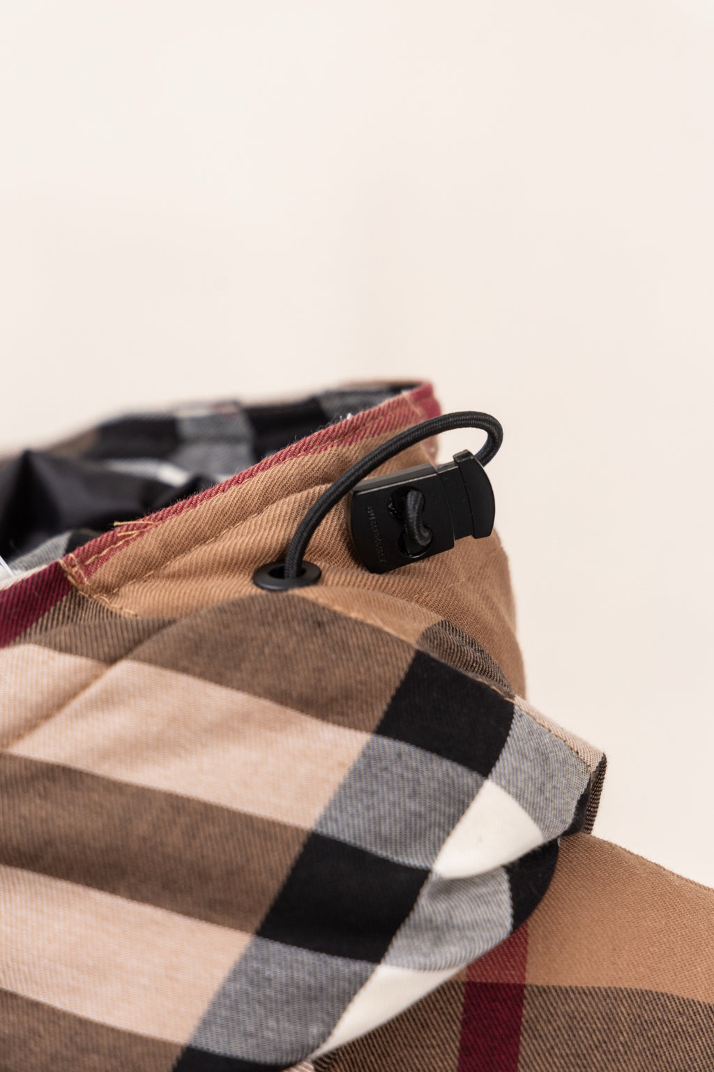 Burberry plaid hood with black drawcord and contrast trim