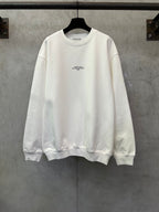 White crewneck sweatshirt with small chest logo on the front