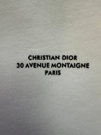White sweatshirt fabric with "CHRISTIAN DIOR 30 AVENUE MONTAIGNE PARIS" text
