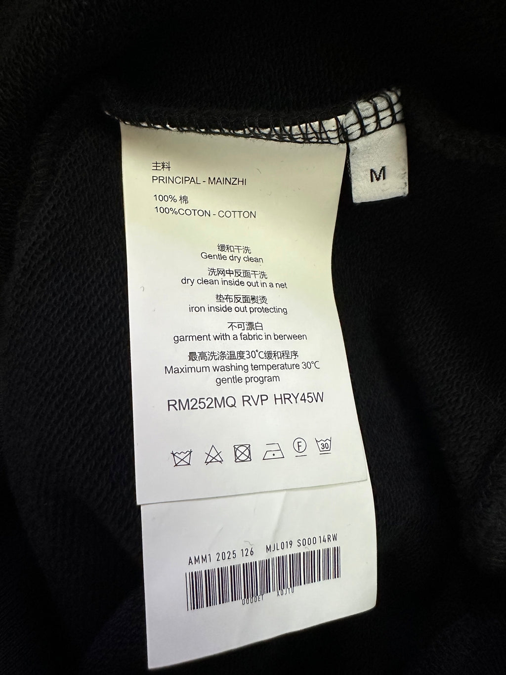 Inside label: size M, 100% cotton, care instructions
