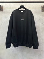 Black crewneck sweatshirt with small chest logo print