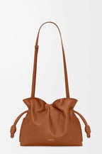 Loewe tan leather drawstring bag with top braided cord pulls and long handles