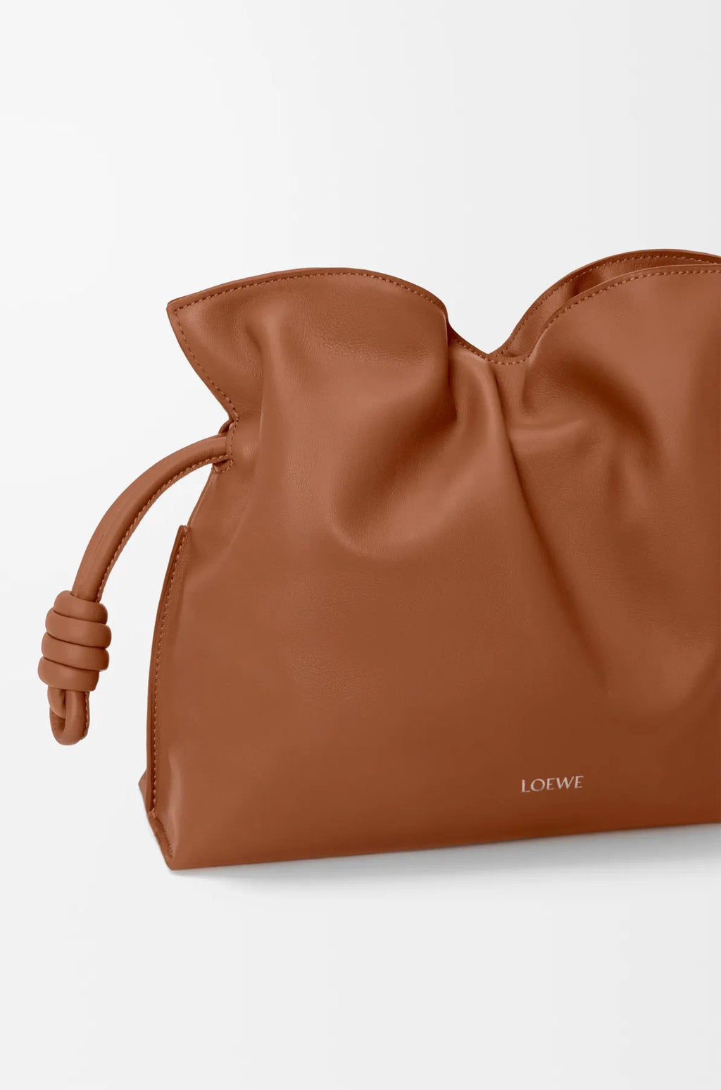 Loewe tan leather drawstring bag close-up with gathered top and front logo