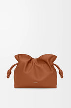 Loewe tan leather drawstring pouch bag with braided cord pulls and front logo