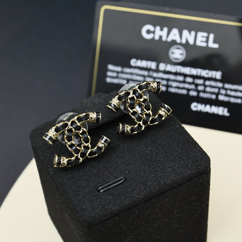 Gold-tone chain drop earrings with stud backs and black link accents