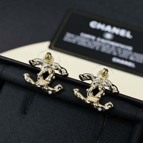 Gold-tone logo stud earrings with pink stones, faux pearls, and clear accents