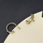 Gold-tone hoop earring and drop stud earring with pearl and rhinestone accents.