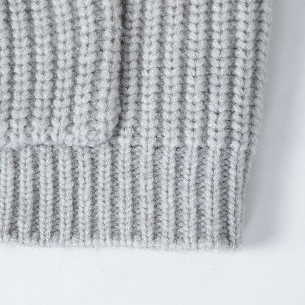 Light gray ribbed knit hoodie hem with vertical stitch texture