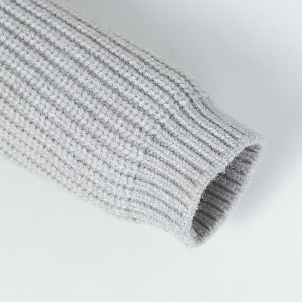 Stone Island knitwear cuff end on light gray ribbed sleeve