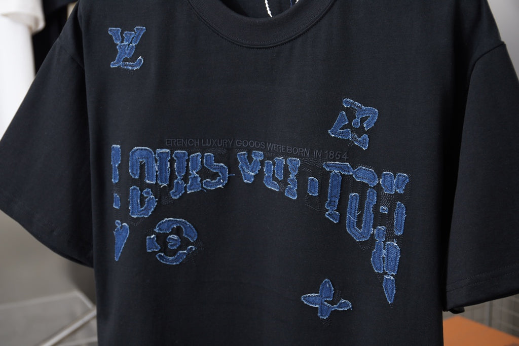 Louis Vuitton black T-shirt with blue LV logo and icon graphic across chest