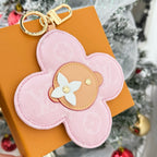 Louis Vuitton pink fabric flower keychain with beige center and gold keyring