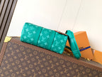 Louis Vuitton green monogram flap-style bag with teal shoulder strap