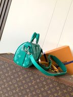 Louis Vuitton green monogram mini bag with side zipper and teal strap