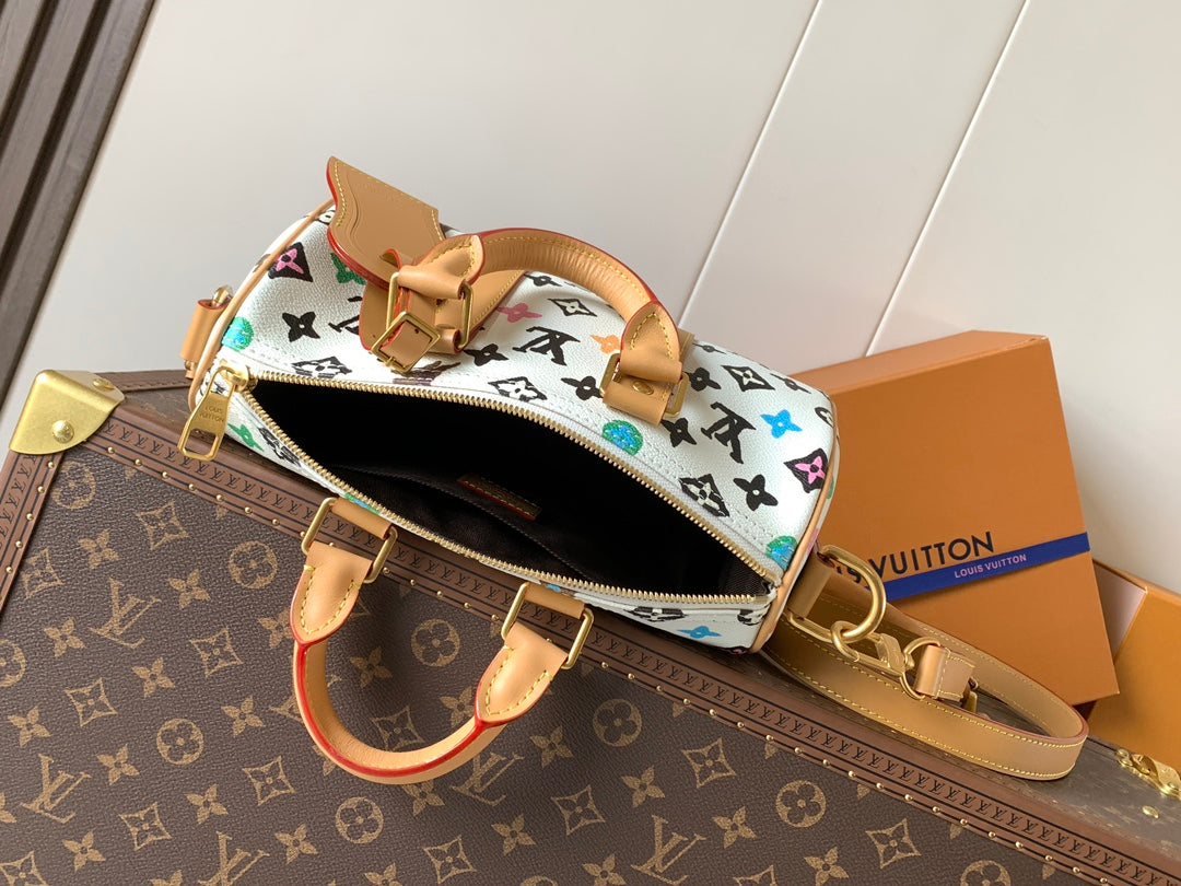 Louis Vuitton mini handbag open showing dark interior and tan crossbody strap