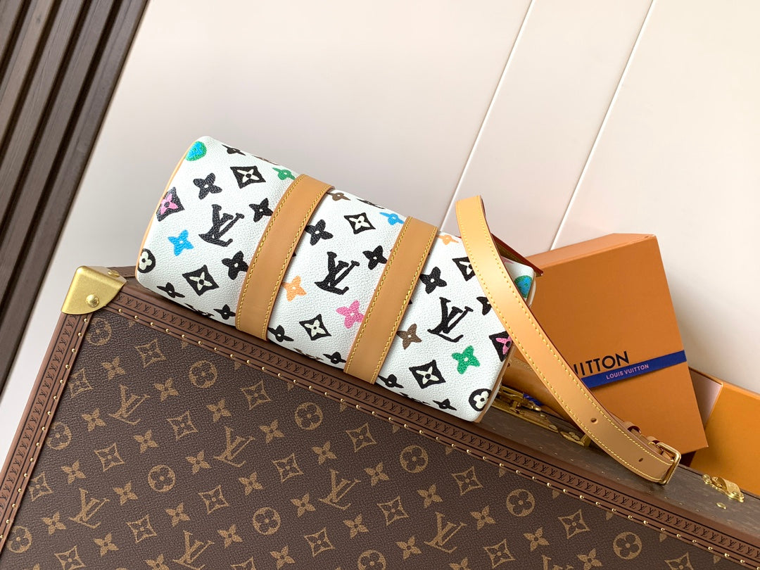 Louis Vuitton mini handbag with colorful monogram print and tan adjustable strap
